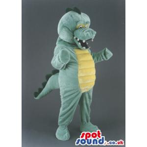 Green and yellow dinosaur mascot with open mouth laughing -