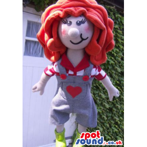 Girl Mascot With Big Red Hair, Wearing Overalls With A Heart -