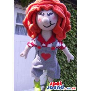 Girl Mascot With Big Red Hair, Wearing Overalls With A Heart -