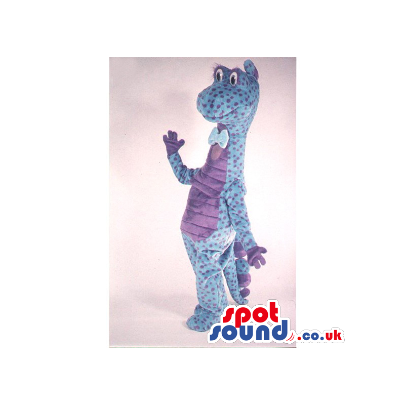 Blue Dinosaur Mascot With Purple Dots Wearing A Bow Tie -