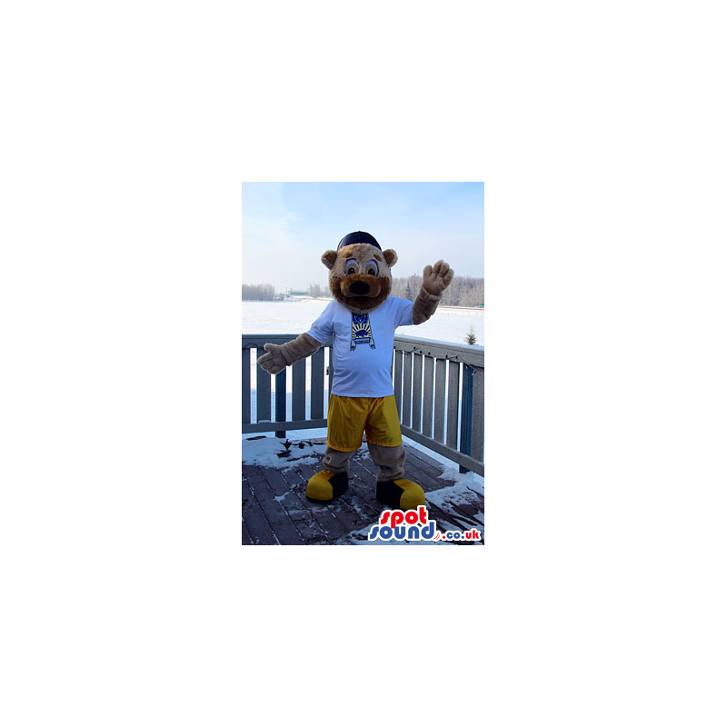 Bear Mascot With A Half Beige And Brown Face In Yellow Shorts -