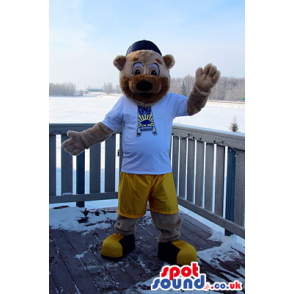 Bear Mascot With A Half Beige And Brown Face In Yellow Shorts -