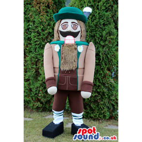 Nut-Cracker Soldier Mascot Wearing Brown And Green Garments -
