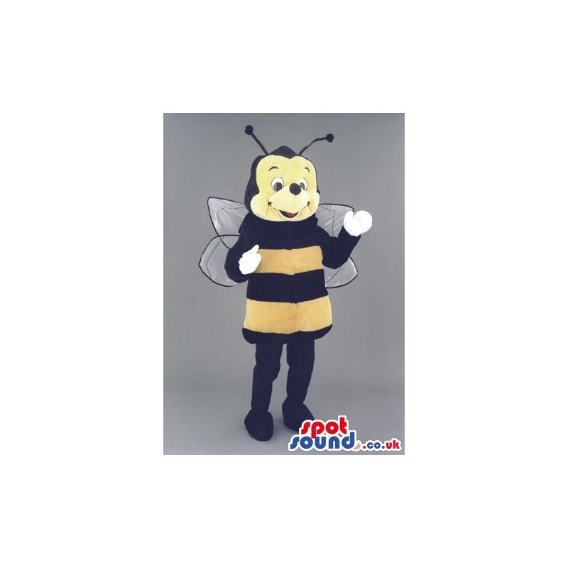 Cute little bumble bee mascot with a happy smile in his face -