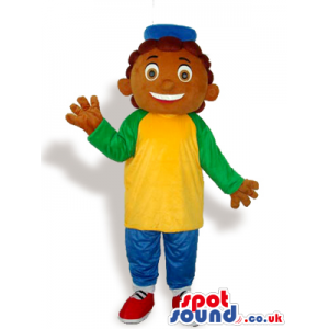 Happy Boy Mascot Wearing Green And Yellow Clothes And A Cap -