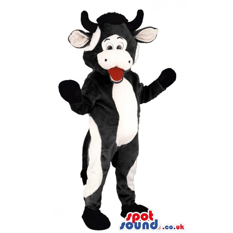Black and white cow mascot standing and opening his mouth -