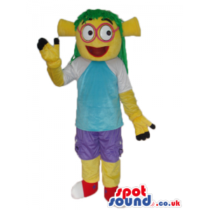 Yellow Alien Mascot Wearing Blue Street Wear Garments And