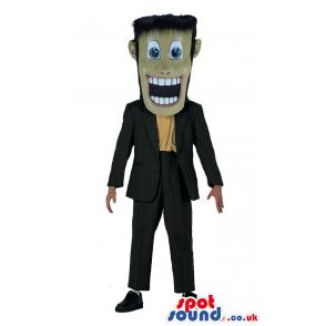 Man mascot with a black suit, yellow shirt and lovely shoes -