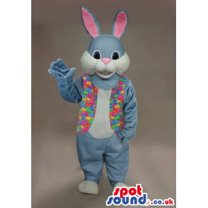 Blue Rabbit Mascot With A Pink Nose Wearing A Flowery Vest -