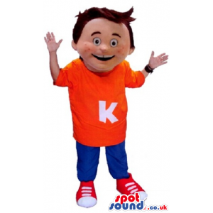 Happy Boy Mascot Wearing Blue And Red Clothes With Letter K -