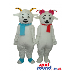 Two Boy And Girl Goat Mascots Wearing Blue And Red Scarves -