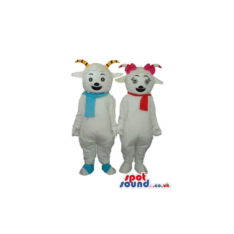 Two Boy And Girl Goat Mascots Wearing Blue And Red Scarves -