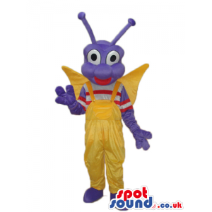 Happy Purple Butterfly Mascot With Yellow Overalls And Wings -