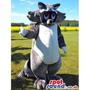 Giant black and white mascot with a cute look waving hand -