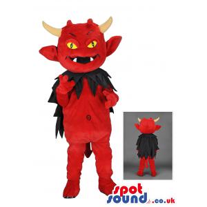 Red devil mascot with black cloak and bright yellow eyes -