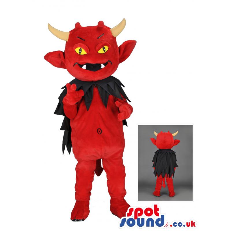 Red devil mascot with black cloak and bright yellow eyes -