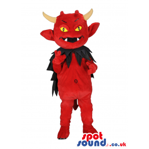 Red devil mascot with horns, black cape and pointy tail, -