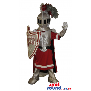 Medieval Warrior Mascot Wearing Red And Silver Garments -