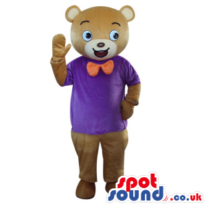 Brown Bear Plush Mascot Wearing A Now Tie And Purple T-Shirt -