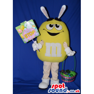 Yellow M&M'S Chocolate Mascot With Rabbit Ears And Basket -
