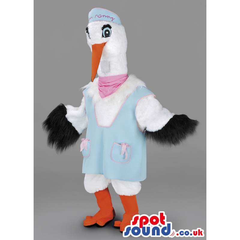 White pelican in blue outfit, pink foulard, orange beak and