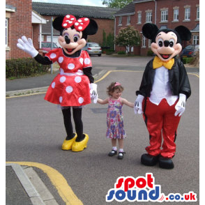 Mickey mouse in smart outfit and minnie mouse in polka dress -