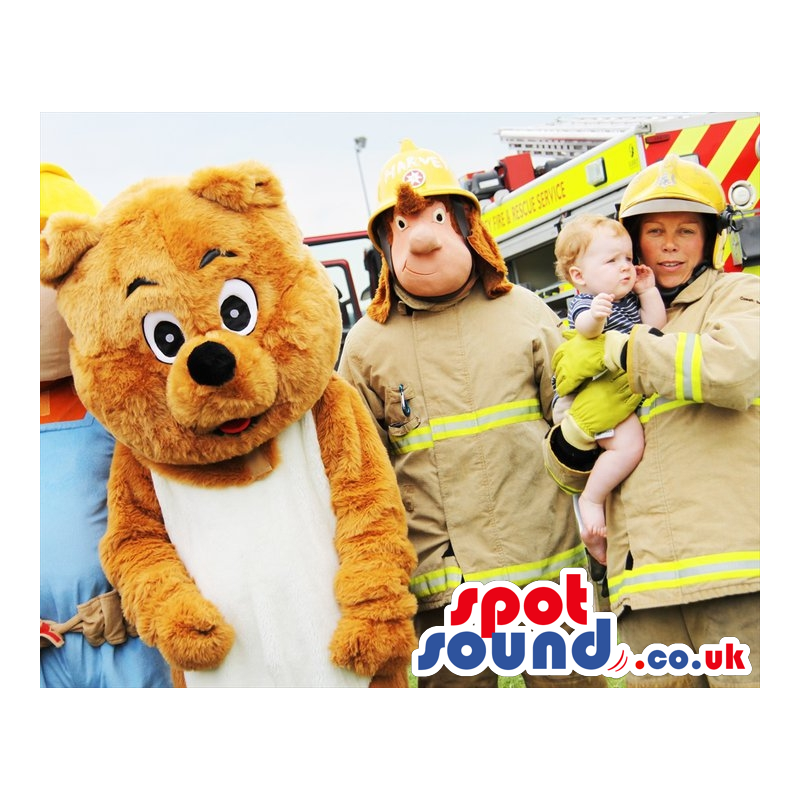 Standing bear mascot and fireman mascot in full fireman uniform