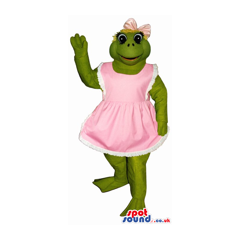 Green Frog Mascot Wearing A Pink Dress Or Apron And A Ribbon -