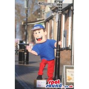 Smiling blue postman mascot with blue hat and red trousers -