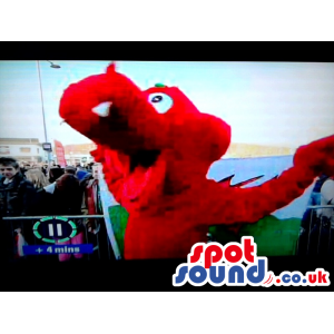 Welsh red dragon mascot with mouth open and sharp white teeth -