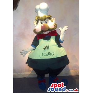 Chef Or Cook Mascot With A Big Nose In A A Green Apron With