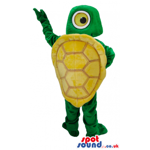 Standing green turtle with big round eyes and yellow shell -