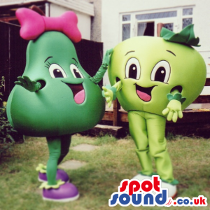Two Fruit Couple Mascots With Happy Faces: An Apple And A Pear.