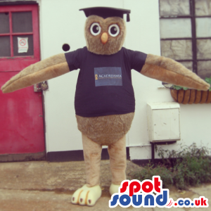 Brown Owl Plush Mascot Wearing A Black T-Shirt With Text -