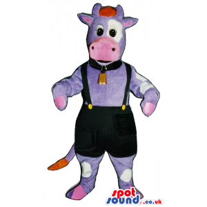 Purple And Pink Cow Mascot Wearing A Bell And Overalls. -