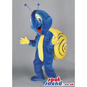 Delighted blue snail mascot with yellow shell and antennae -