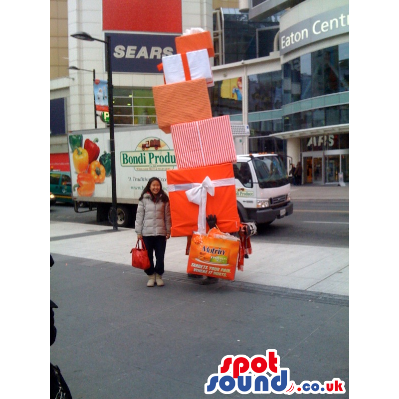 Amazing Stack Of Presents Mascot In Orange And Red - Custom