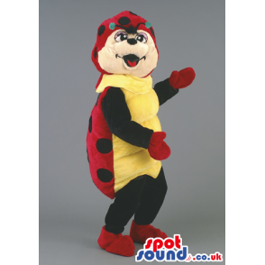 Jolly looking ladybird mascot with red gloves and shoes -