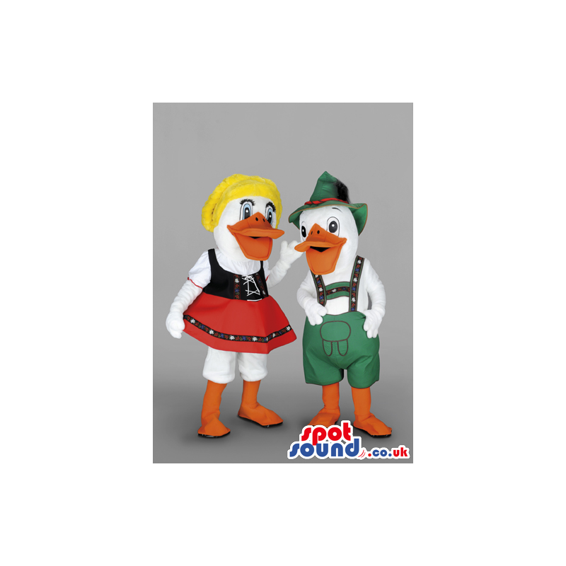 Male and female duck wearing traditional bavarian clothes -
