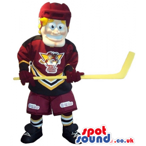 Blond Man Mascot Wearing Ice-Hockey Clothes And A Stick -