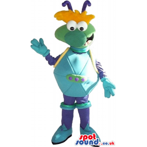 Cosmic Green Creature Mascot In Blue Clothes And Orange Hair -