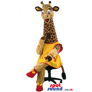 Long necked giraffe mascot wearing yellow and red outfit. -