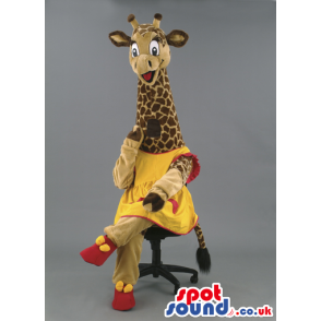 Long necked giraffe mascot wearing yellow and red outfit. -