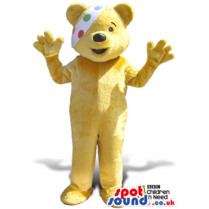 Yellow Bear Plush Mascot With A Colorful Dots Eye-Patch -