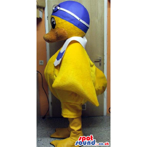 Yellow Duck Plush Mascot Wearing Blue Swimming Gear And A Towel