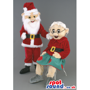 Mr and Mrs Claus mascot in traditional red santa outfil -