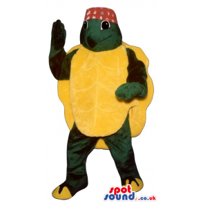 Turtle Plush Mascot With A Huge Yellow Back Shell Wearing A Hat