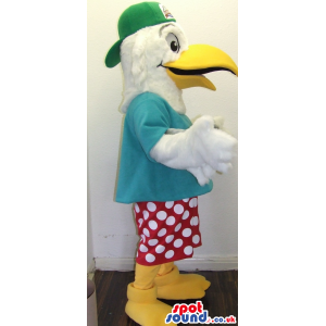 Cool White Bird Plush Mascot Wearing A Green Cap And Dots