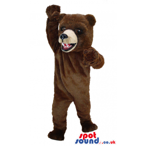 Giant standing brown bear mascot with big eyes and beige snout