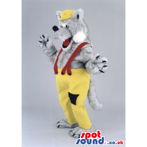 Fluffy grey wolf wearing yellowcap and trousers with black